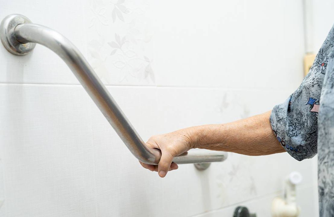 An older adult using a grab bar in the bathroom. Next Avenue, Adapted Equipment (AE) Orthotics Older adults, caregiving