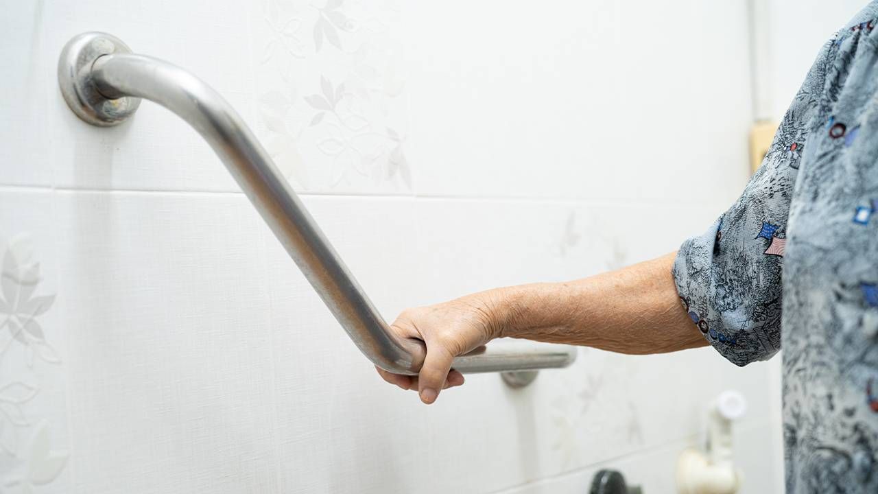 An older adult using a grab bar in the bathroom. Next Avenue, Adapted Equipment (AE) Orthotics Older adults, caregiving