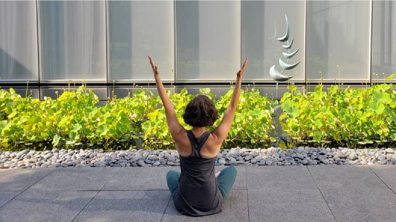 A person holding a yoga pose at an art museum. Next Avenue, Mindfulness, meditation, museum
