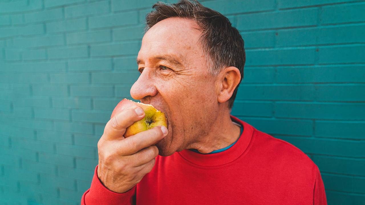 An older man eating an apple. Next Avenue, misophonia, annoyed by sounds