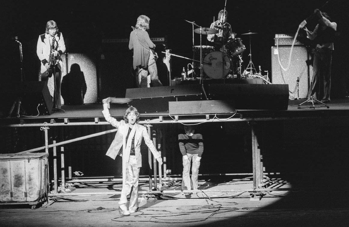 A black and white photo of the Rolling Stones during a concert. Next Avenue, the rolling stones 1972 tour