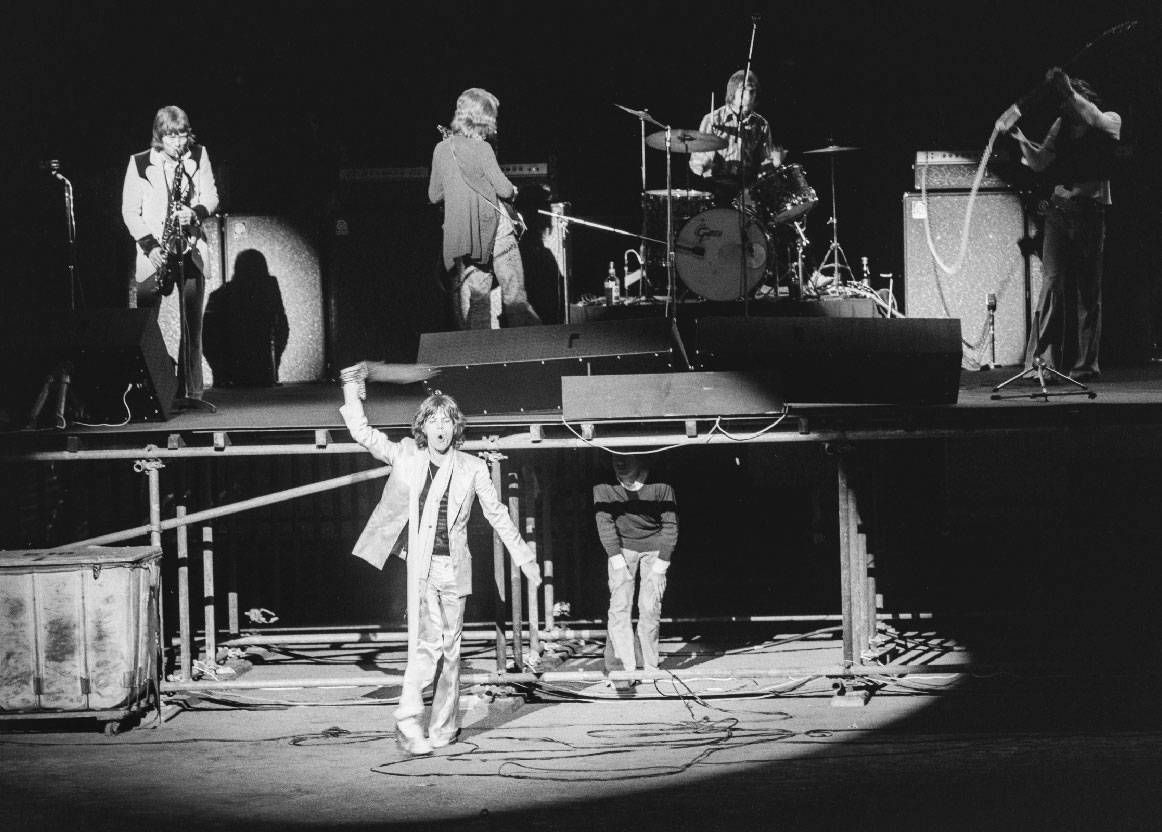 A black and white photo of the Rolling Stones during a concert. Next Avenue, the rolling stones 1972 tour