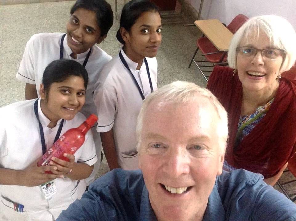 A couple posing with three nursing students. Next Avenue, retirement travel