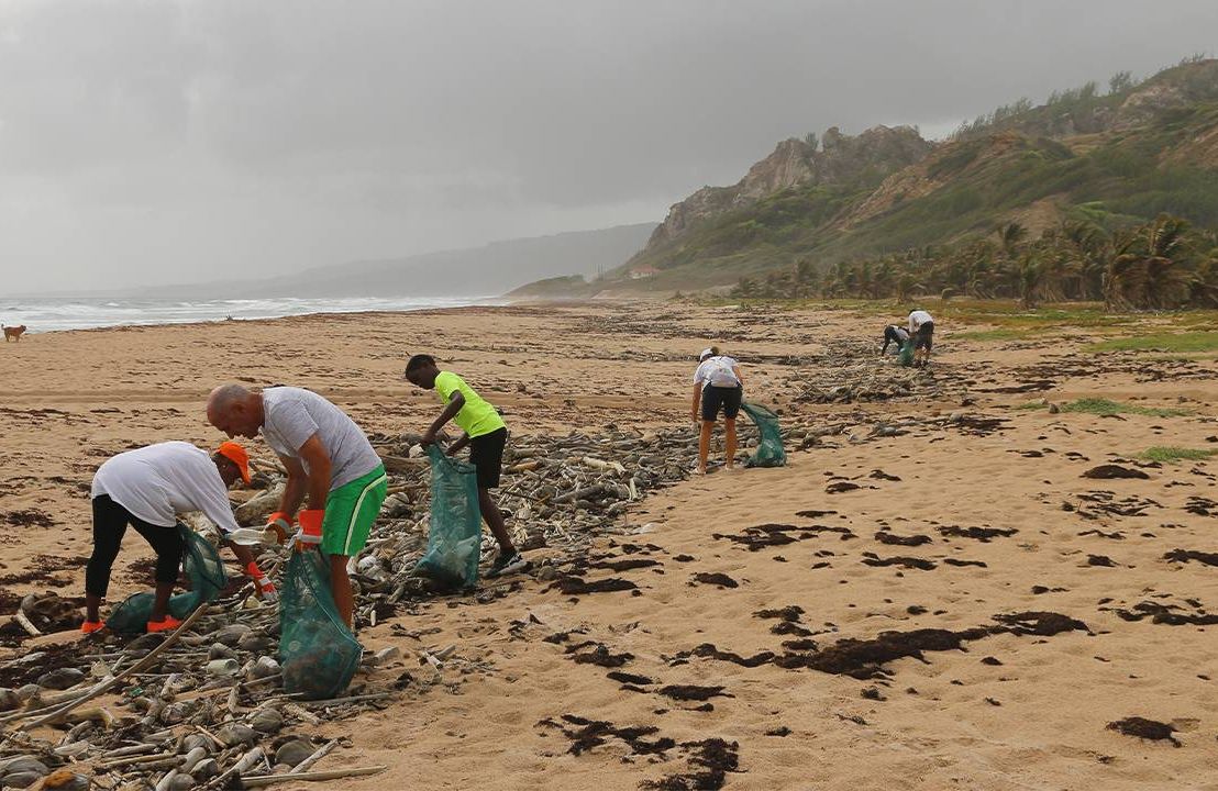 A group of volunteers volunteering for a beach clean-up. Next Avenue, volunteering ideas, retirement
