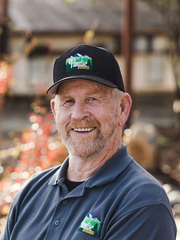 A man wearing a baseball hat smiling. Next Avenue, wildfires, camp fire, paradise