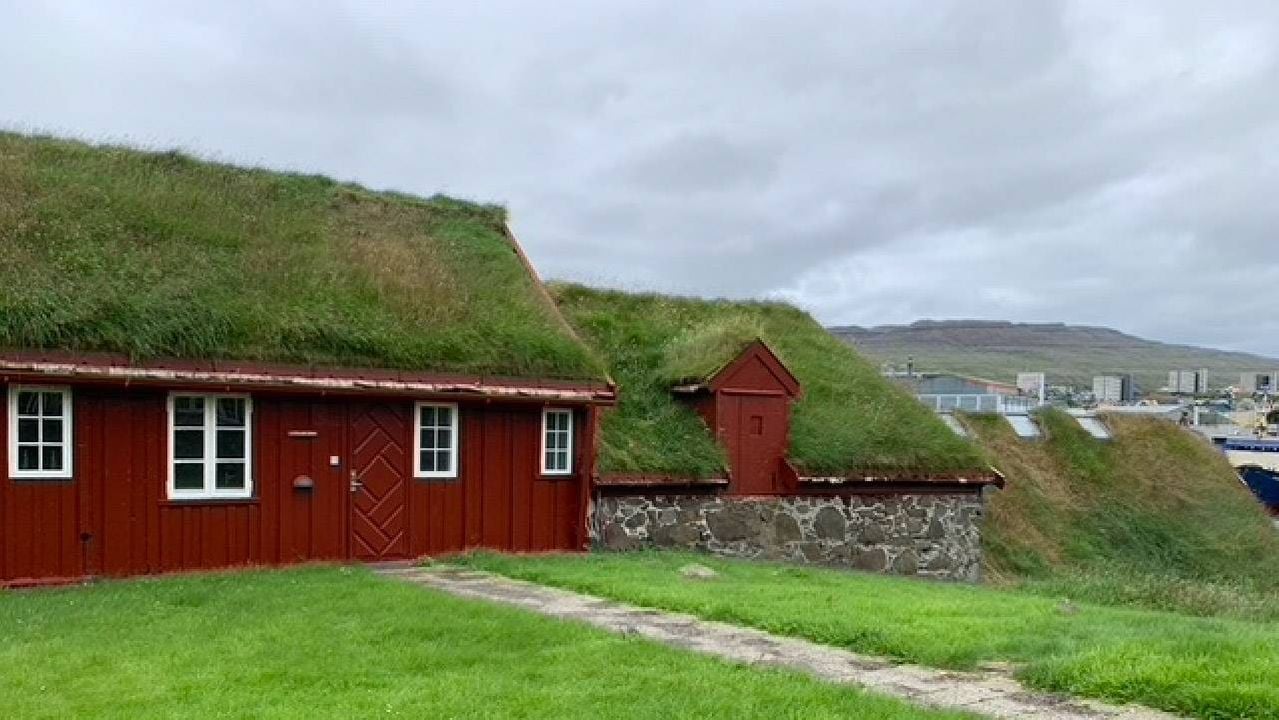 A red cottage with a living grassy rooftop. Next Avenue, Faroe Islands history vikings