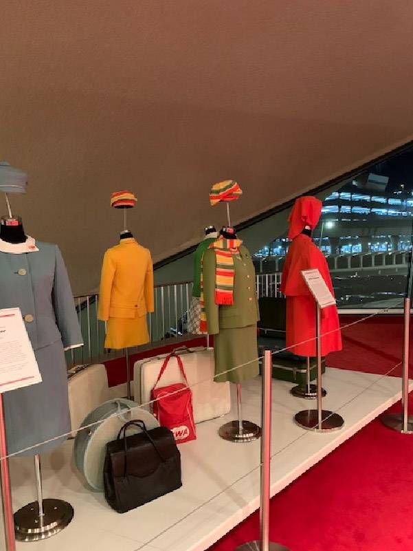 Several dress forms with flight attendant uniforms from the 1960s. Next Avenue, JFK Airport, TWA Hotel