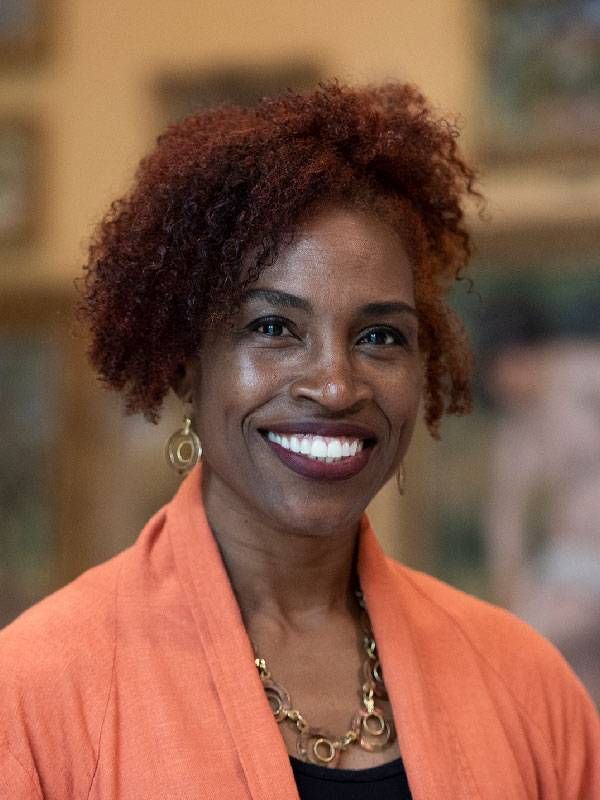 A headshot of woman with red hair smiling. Next Avenue, barnes foundation, art museum