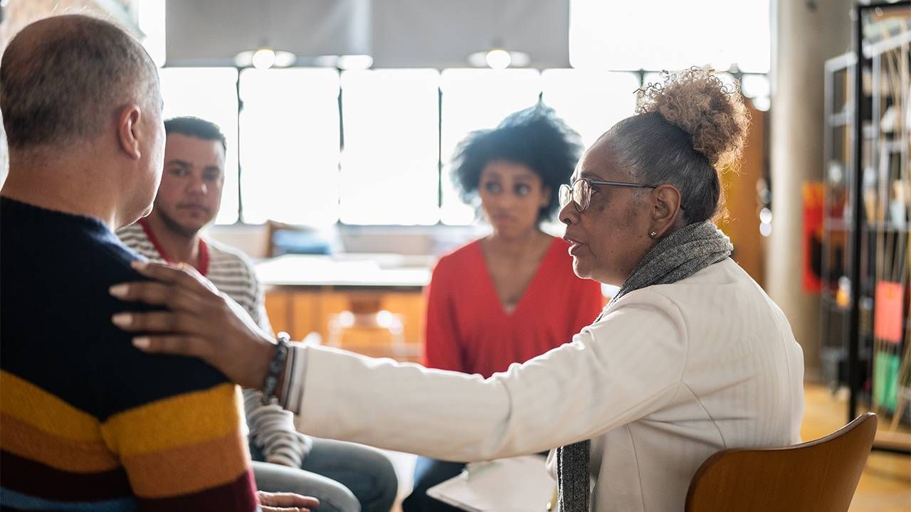 A group of people during a group therapy support group session. Next Avenue