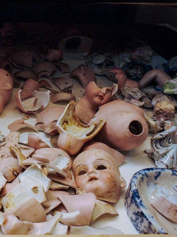 An assortment of old doll heads and body parts.  Next Avenue, backyard treasures
