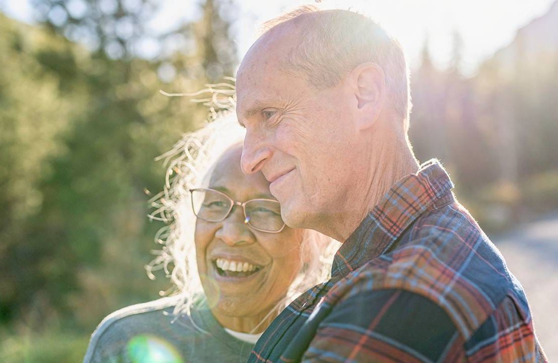 An older couple smiling. Next Avenue, long-term care