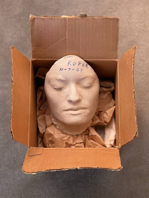 An open box with a clay mask resembling the author. Next Avenue, forgiving your parents