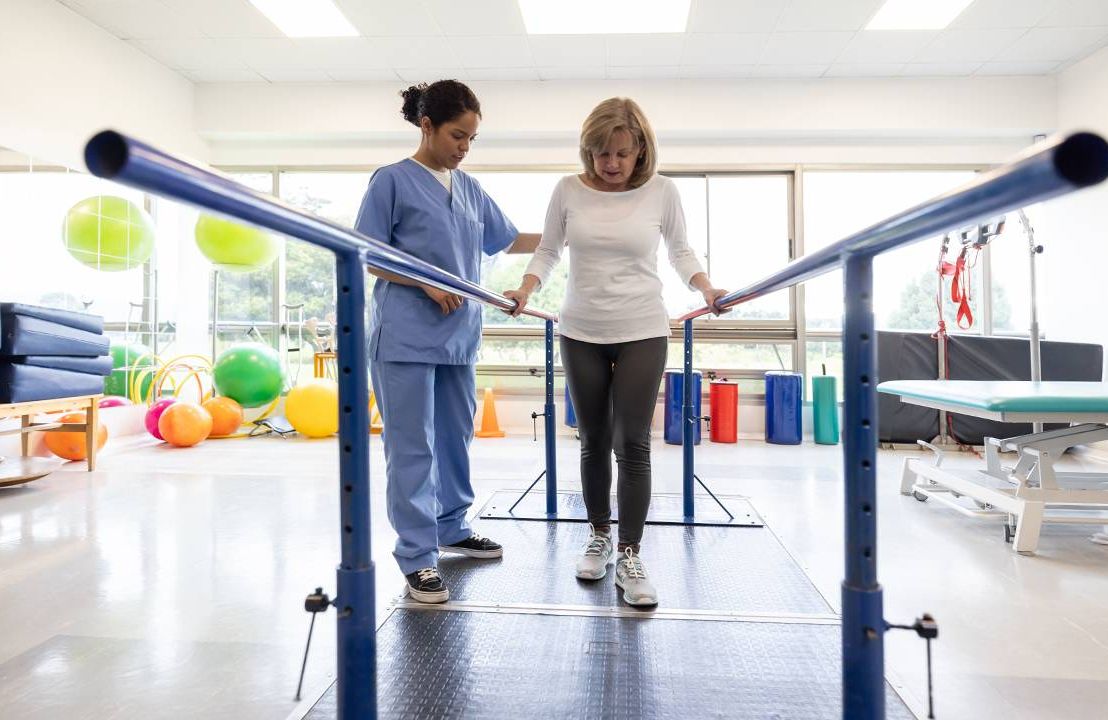 A woman walking during a physical therapy appointment. Next Avenue, healing from surgery, injury, patience