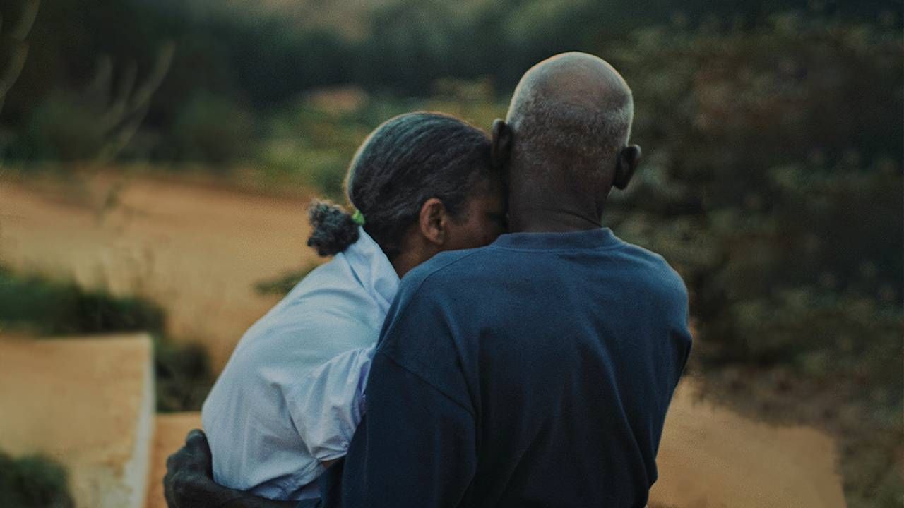 A couple hugging in front of a setting sun. Next Avenue, aging, reasons to live