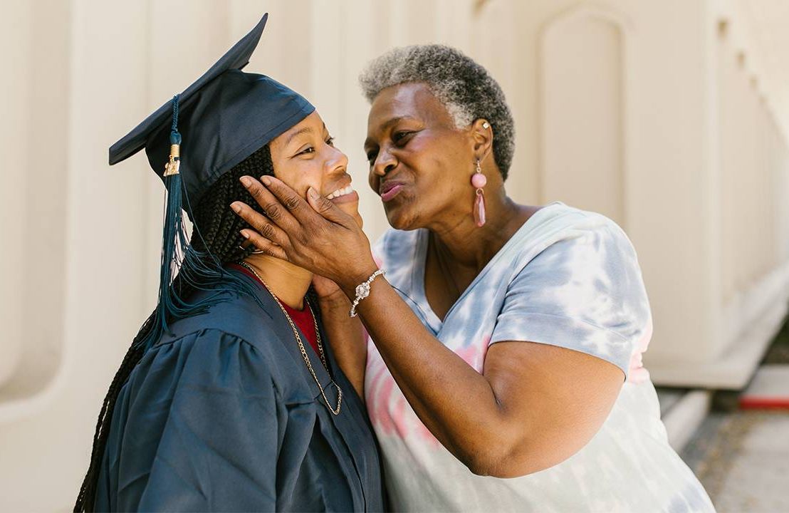 A parent celebrating their child's college graduation. Next Avenue, paying for college, college fund