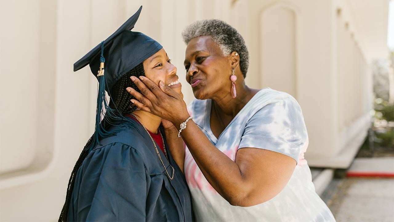 A parent celebrating their child's college graduation. Next Avenue, paying for college, college fund