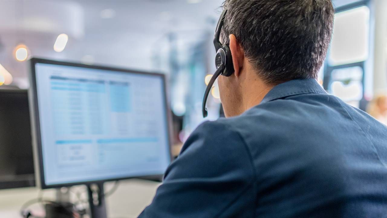 A person working at a call center. Next Avenue, volunteer at suicide hotline