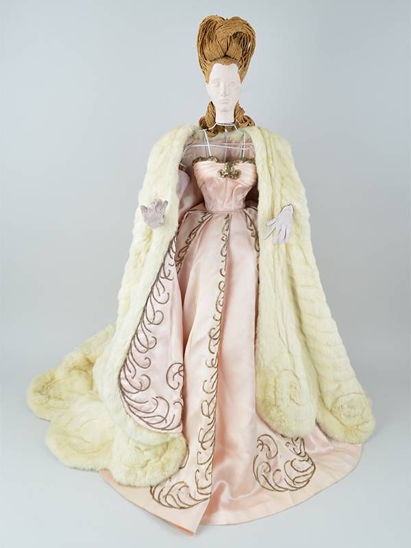 An ornate doll wearing vintage french clothing. Next Avenue