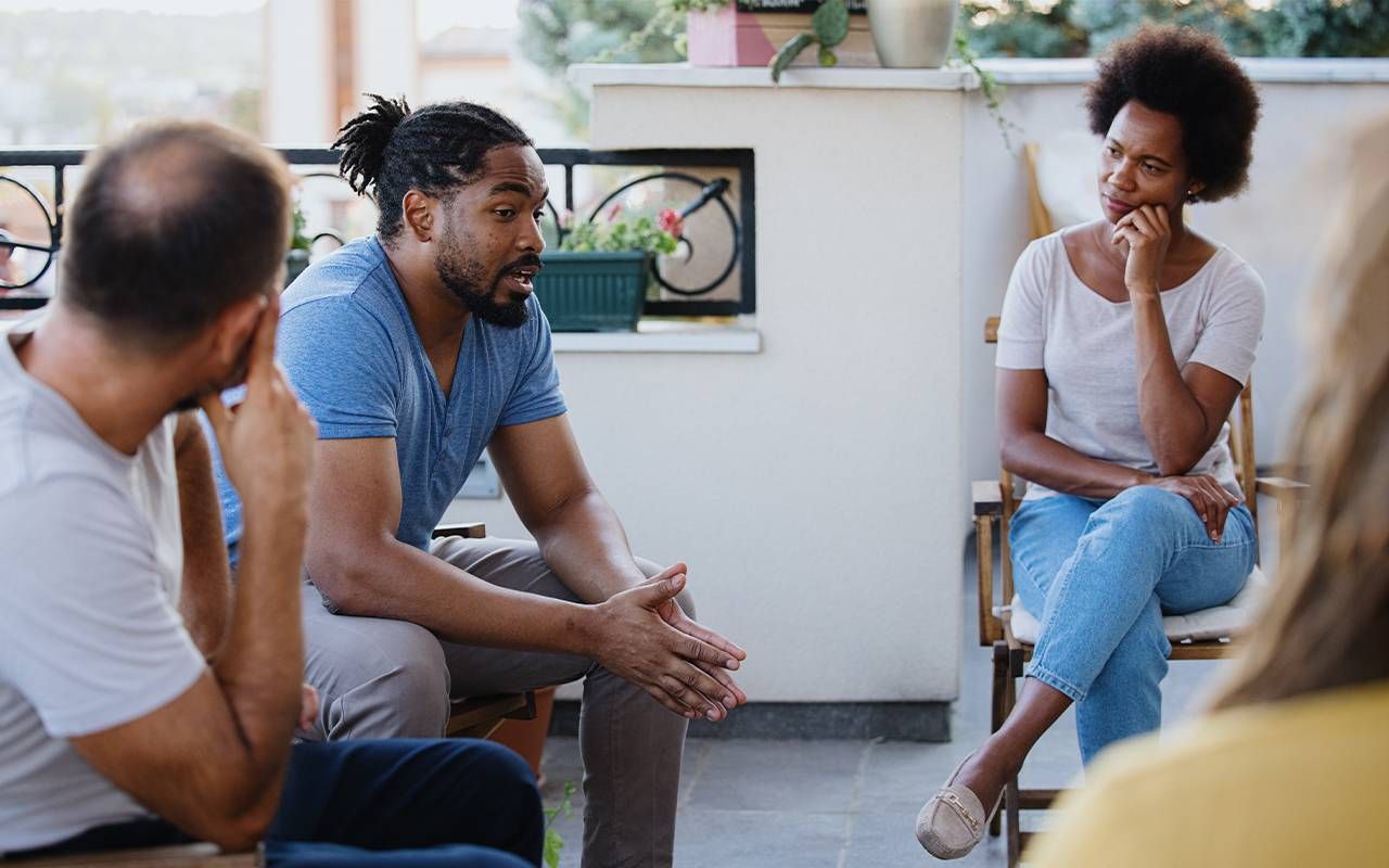 A group of people impacted by suicide during a support group session. Next Avenue, facing suicide