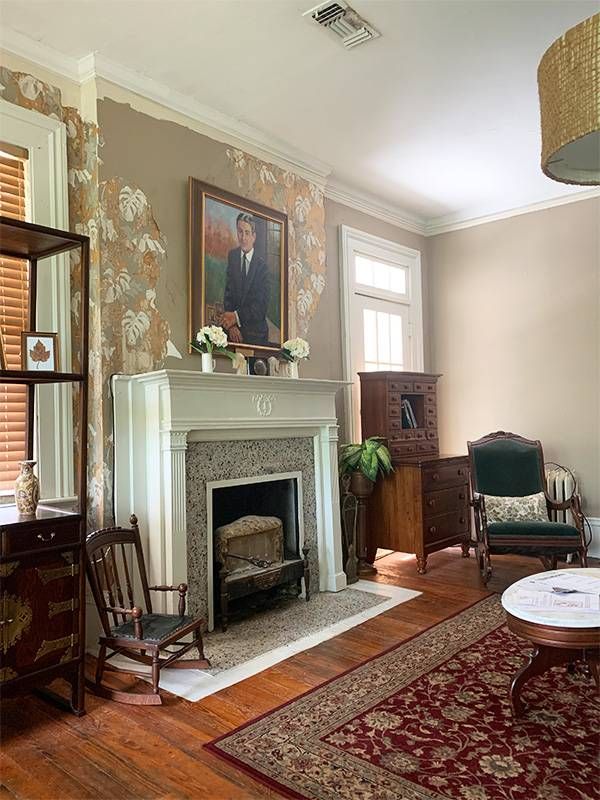A living room with a classic looking fireplace. Next Avenue, museum challenge