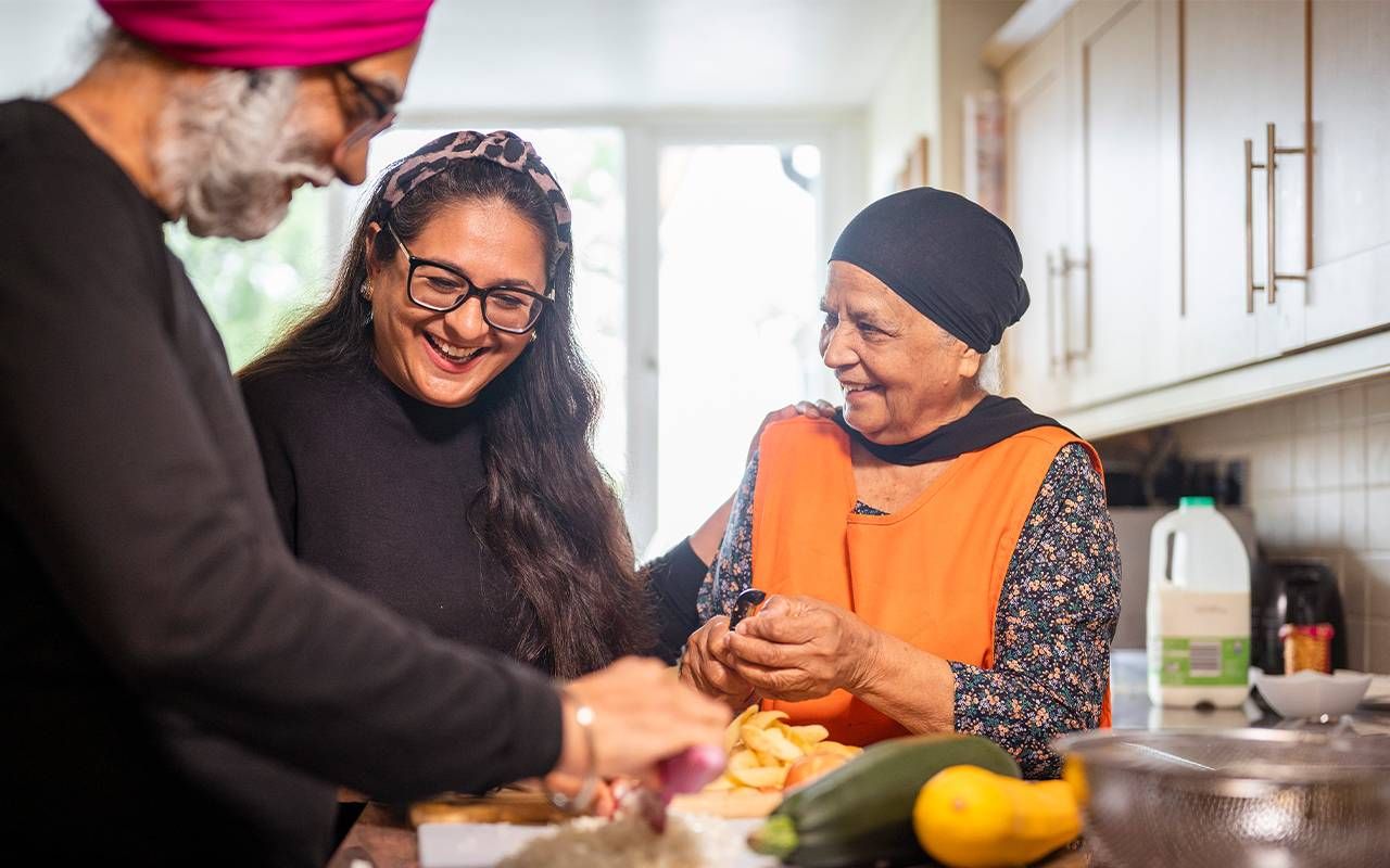 A family and a family caregiver cooking at home. Next Avenue