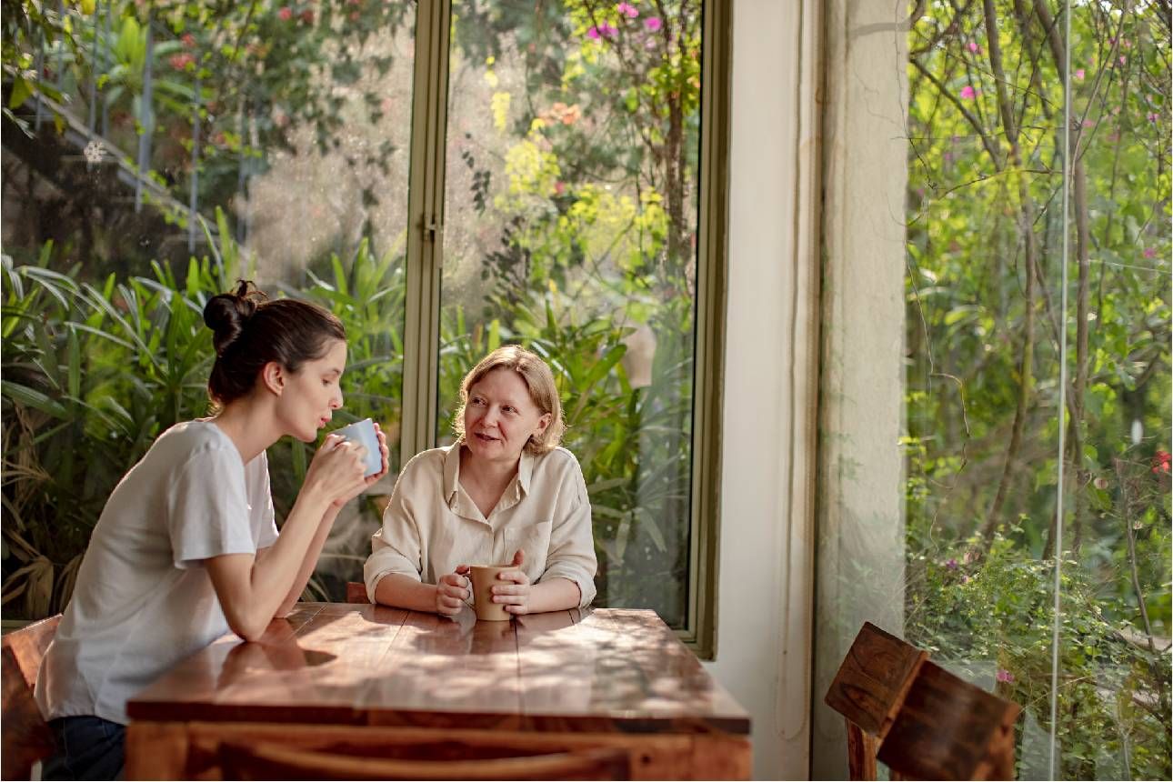 A mother and daughter talking on the porch. Next Avenue