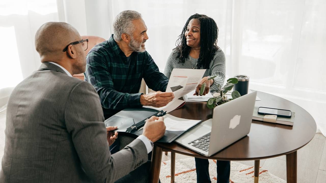 A couple meeting with their financial planner. Next Avenue