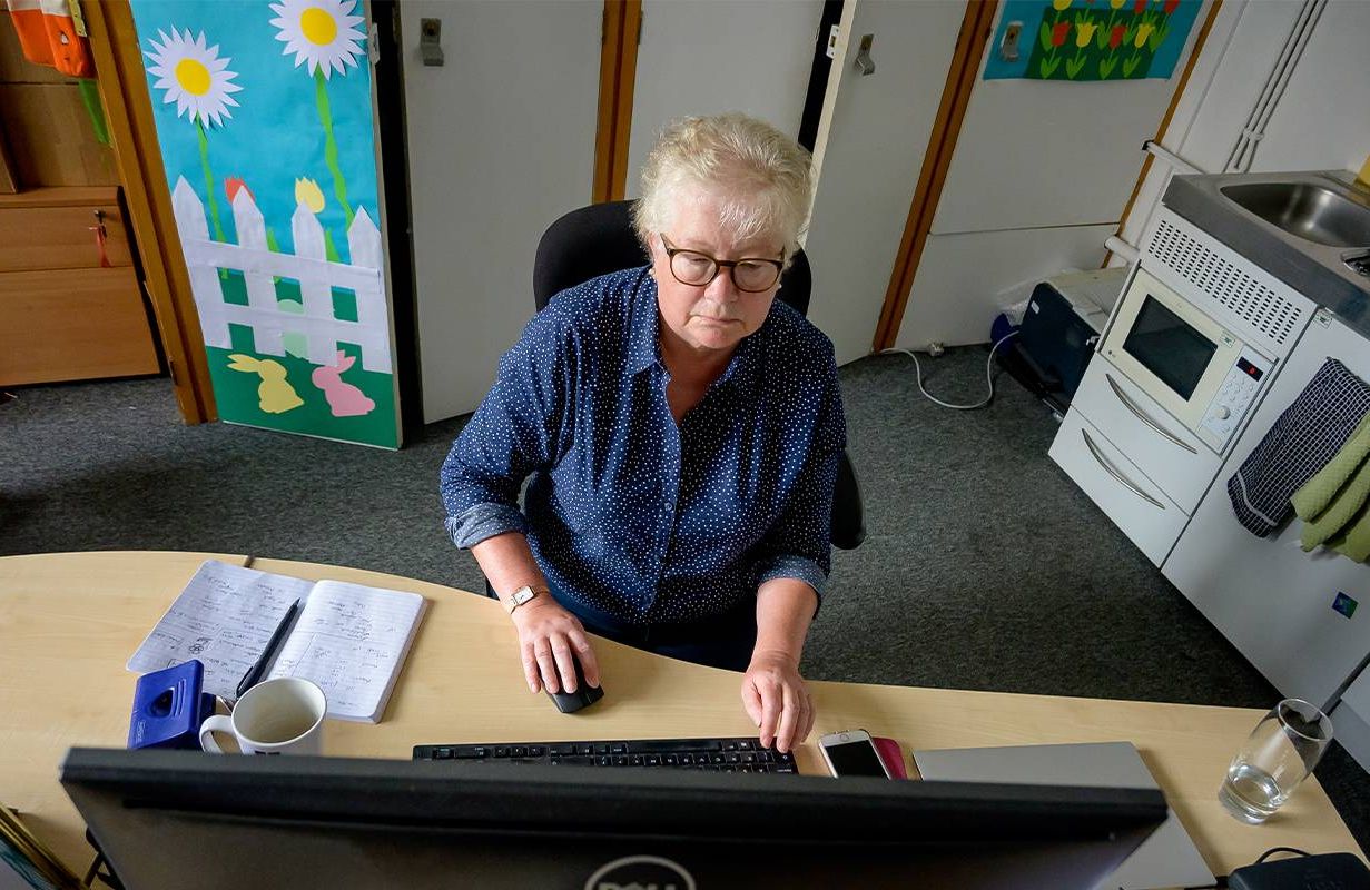 A woman over 50 at work. Next Avenue, older workers, ageism at work