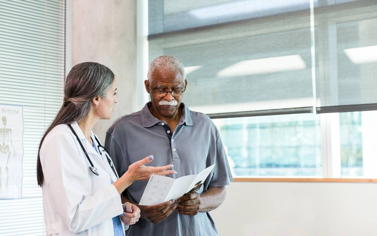 A man getting a second opinion from a doctor. Next Avenue