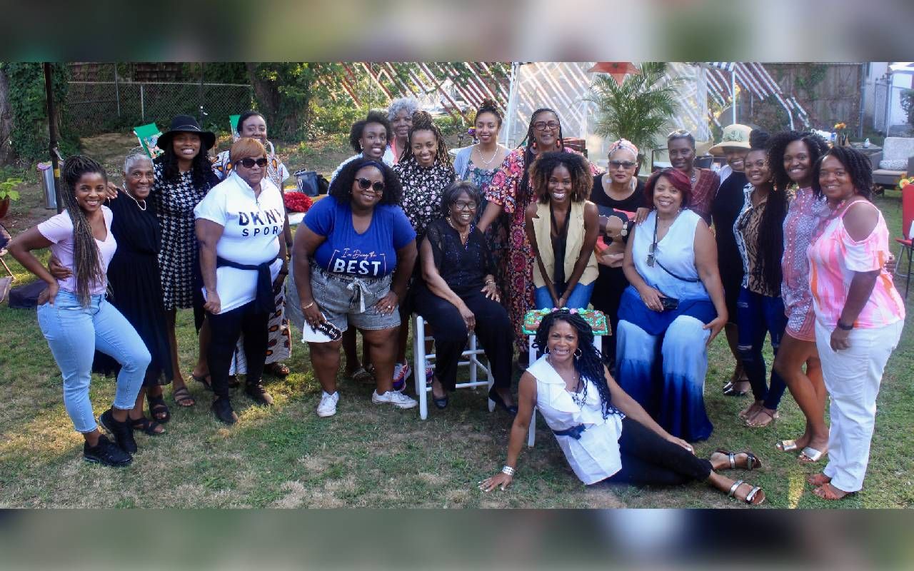 A group of women smiling outside. Next Avenue, generational divide