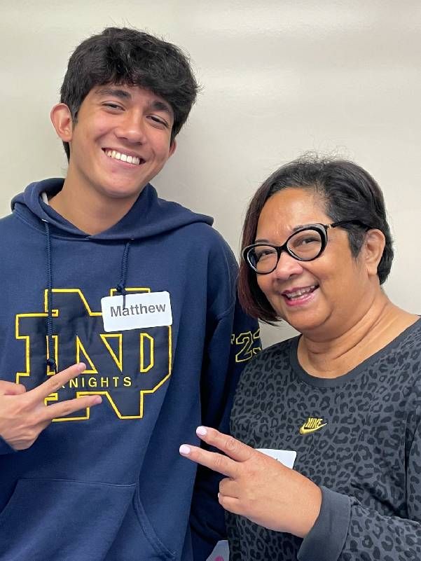 Two people smiling and holding up a peace sign. Next Avenue, generational divide