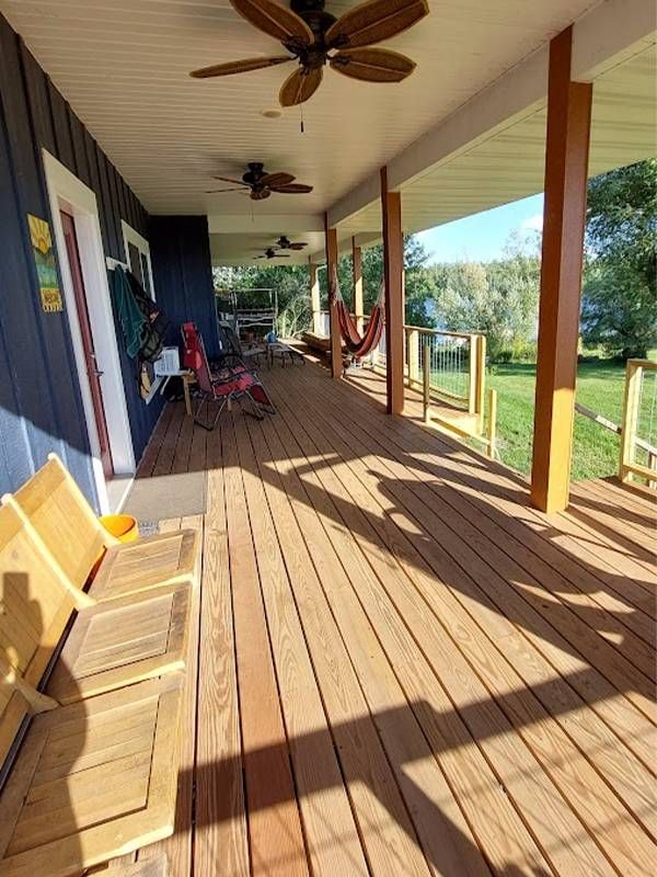 A finished front porch with a wooden floor. Next Avenue, retirement diy, home diy projects