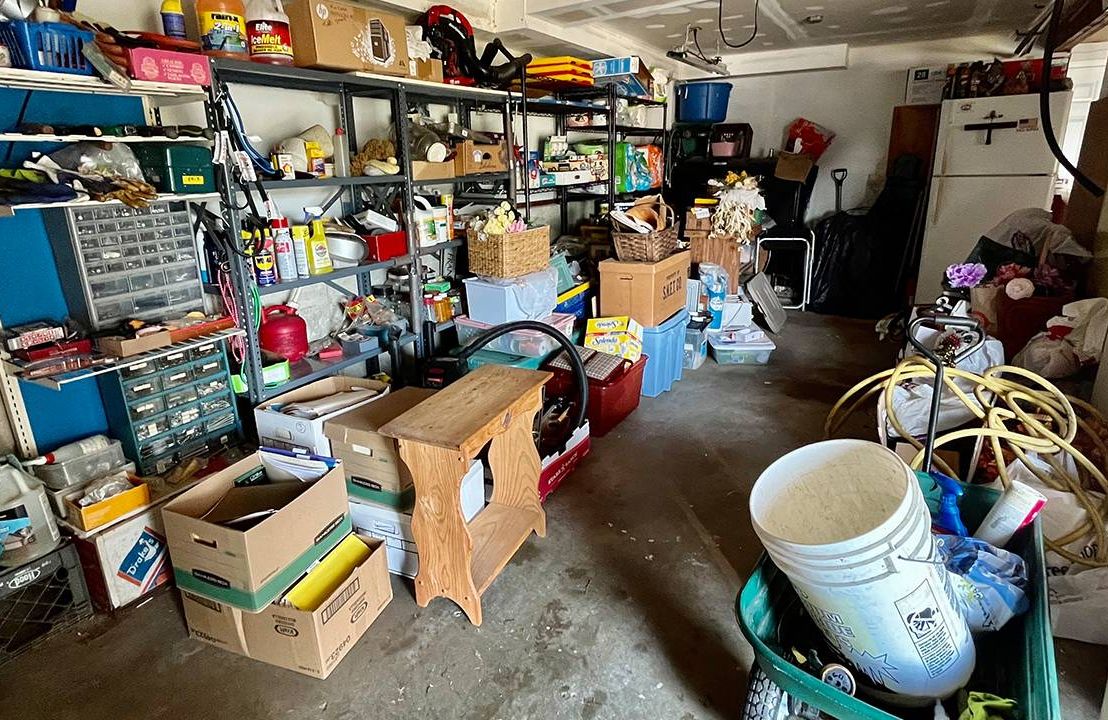 a garage filled with cluttered boxes. Next Avenue