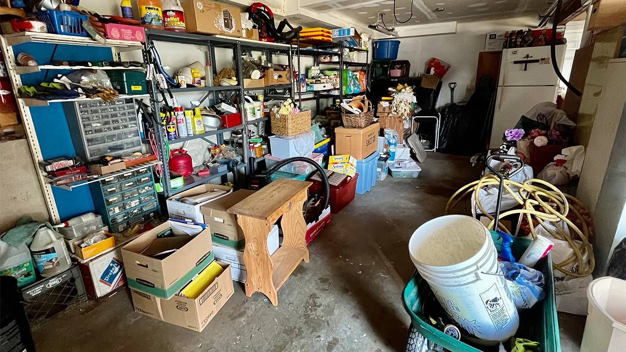 a garage filled with cluttered boxes. Next Avenue