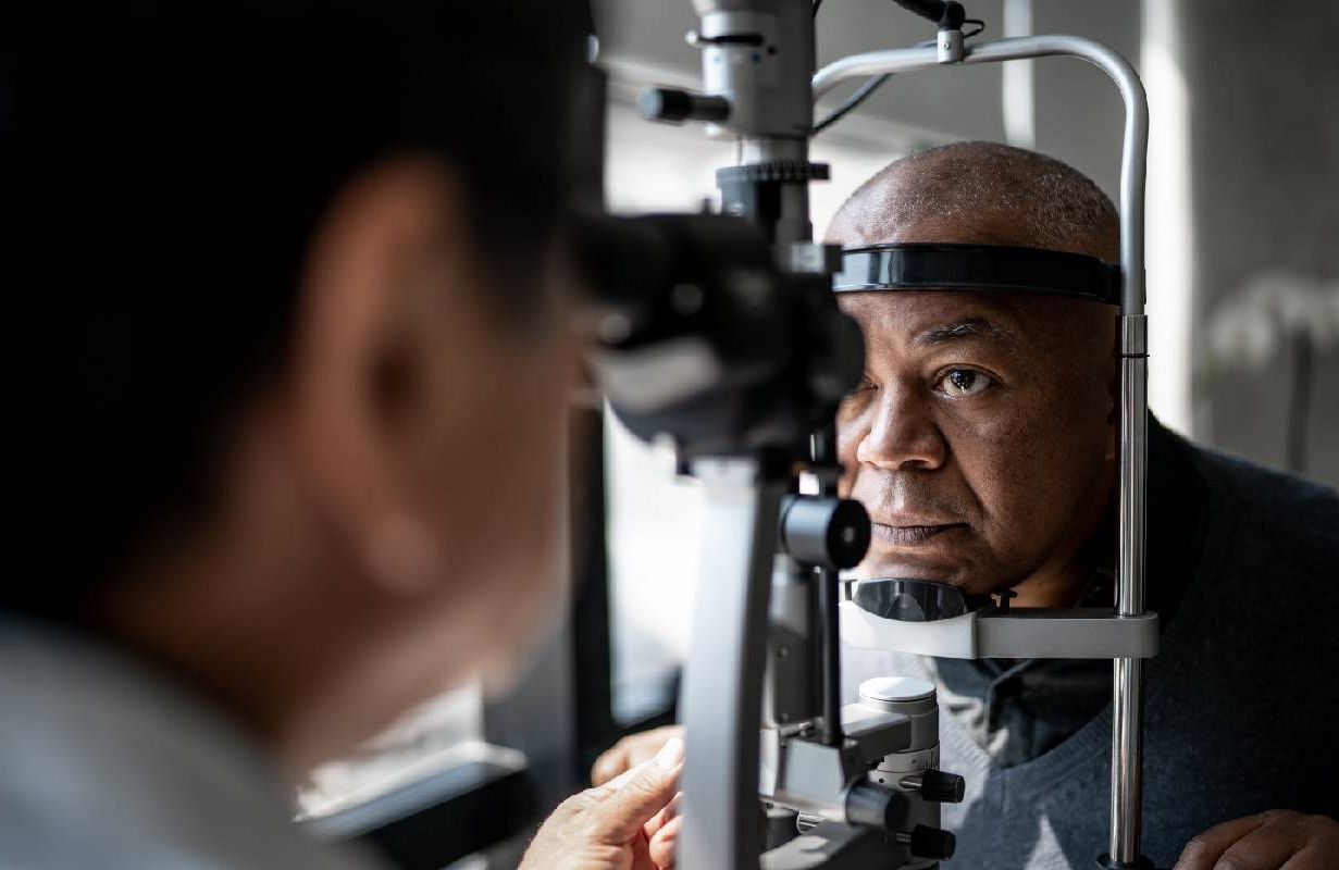 An older man getting an eye exam. Next Avenue, vision, fall prevention