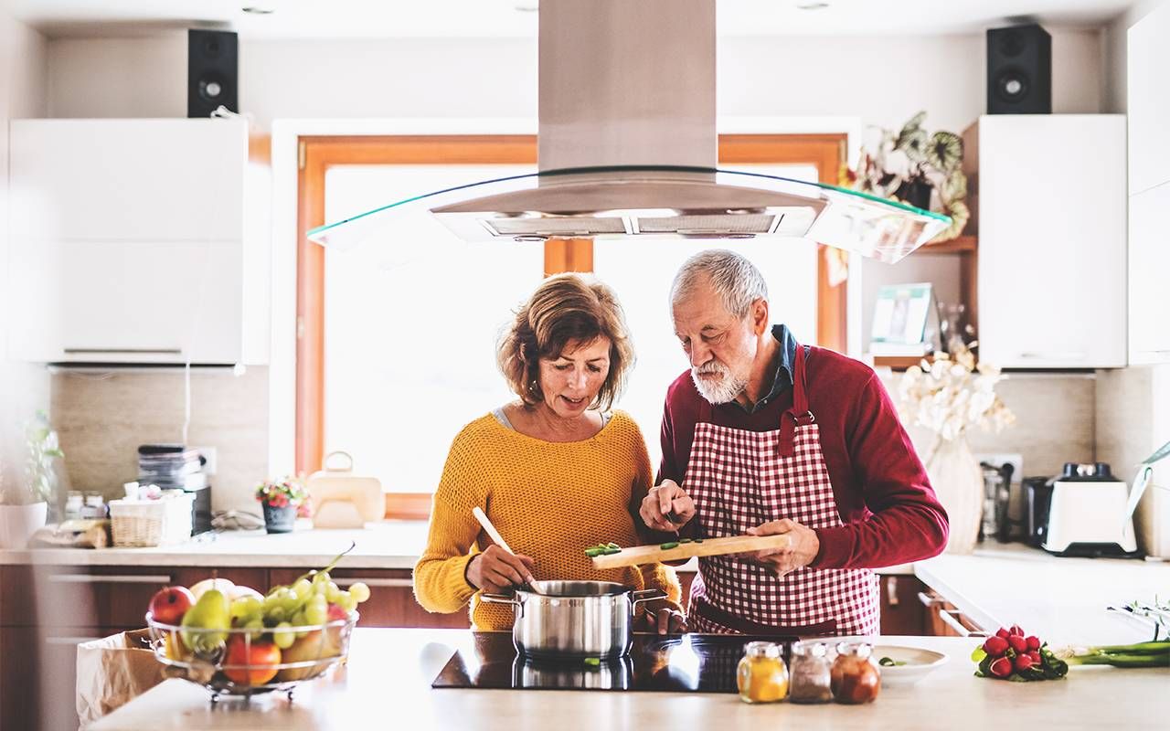 A couple cooking dinner at home. Next Avenue