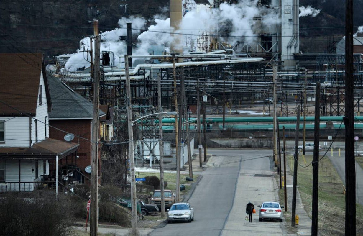 Homes near a steel plant spouting air pollution. Next Avenue, environmental risks, alzheimer's, dementia, pollution