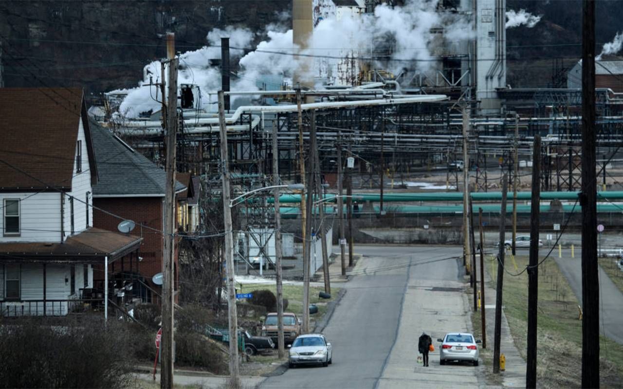Homes near a steel plant spouting air pollution. Next Avenue, environmental risks, alzheimer's, dementia, pollution
