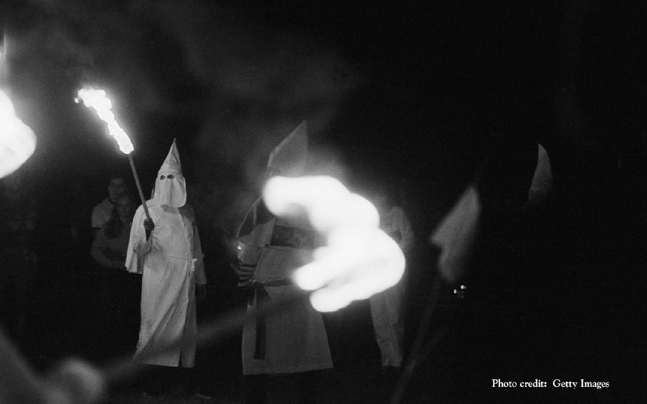 KKK members carrying torches. Next Avenue, Ken Burns, Our America