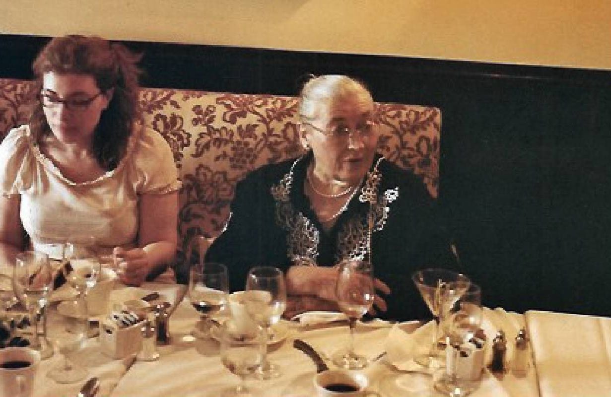 A woman sitting next to her mother at a restaurant. Next Avenue, french cooking