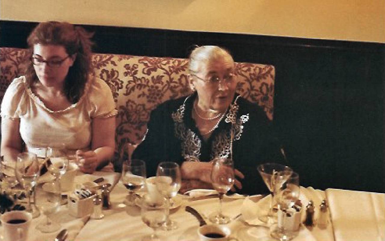 A woman sitting next to her mother at a restaurant. Next Avenue, french cooking