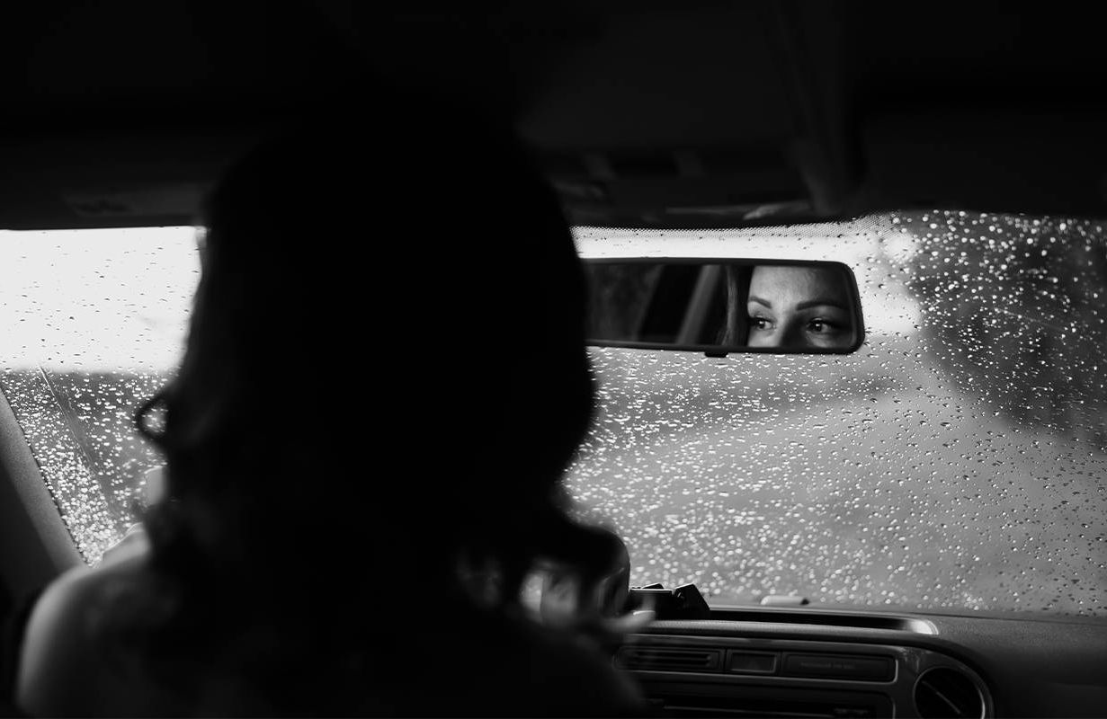 A woman driving in a car. Next Avenue, divorce, dementia