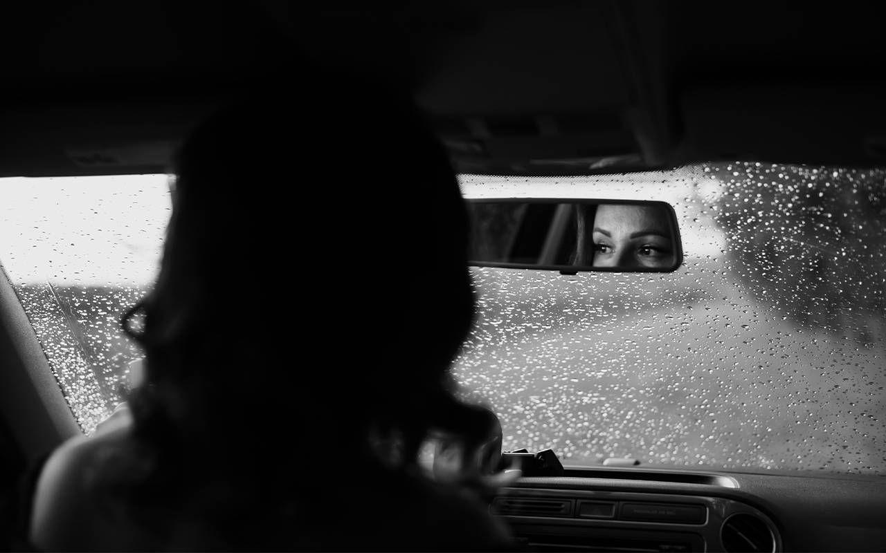 A woman driving in a car. Next Avenue, divorce, dementia