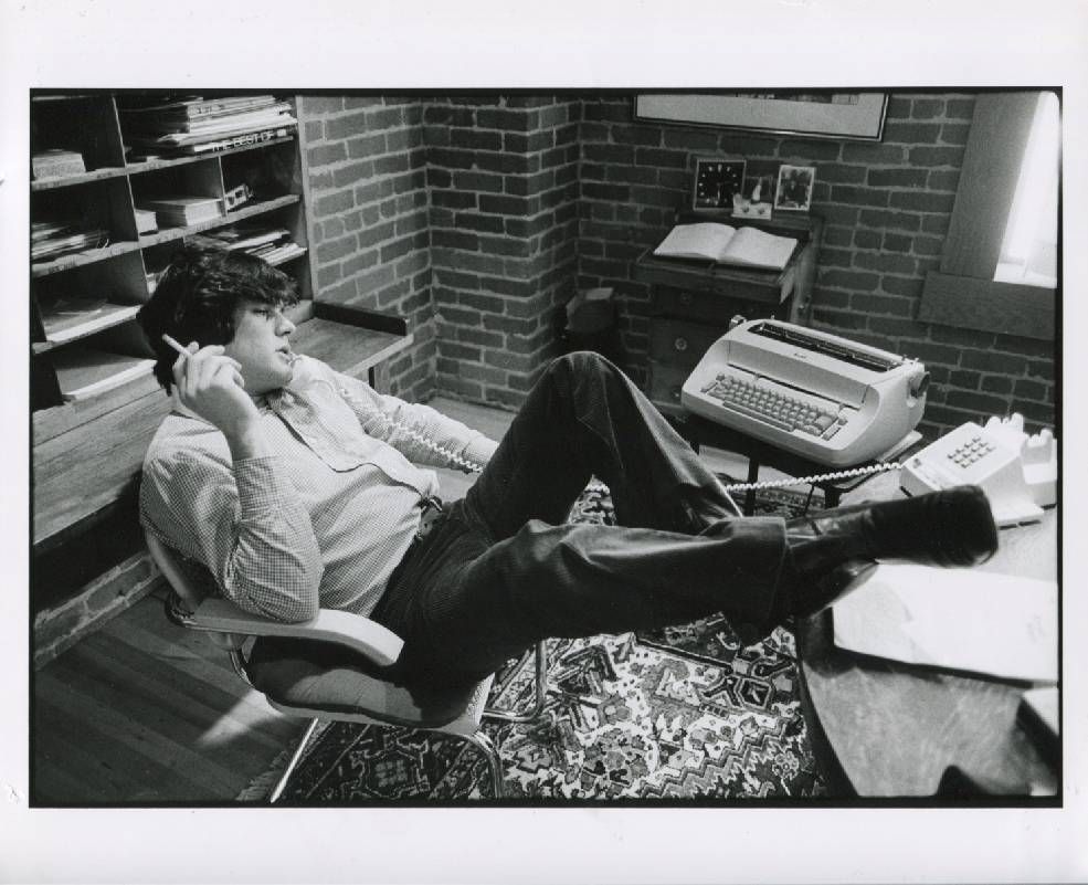 A man with his feet up on a desk, smoking a cigarette. Next Avenue, Jan Wenner, Rolling Stone, book