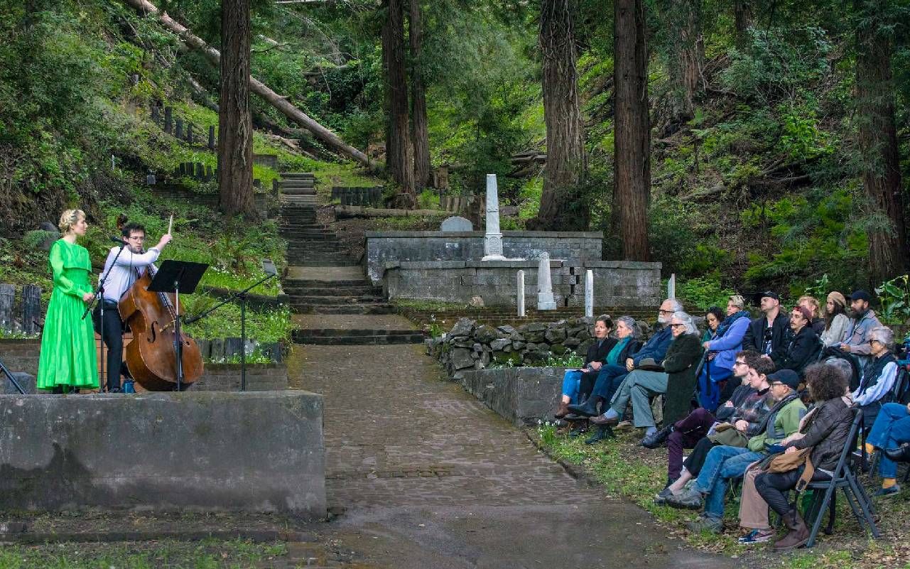 Musicians playing a concert in a graveyard. Next Avenue, Santa Cruz Museum of Art and History