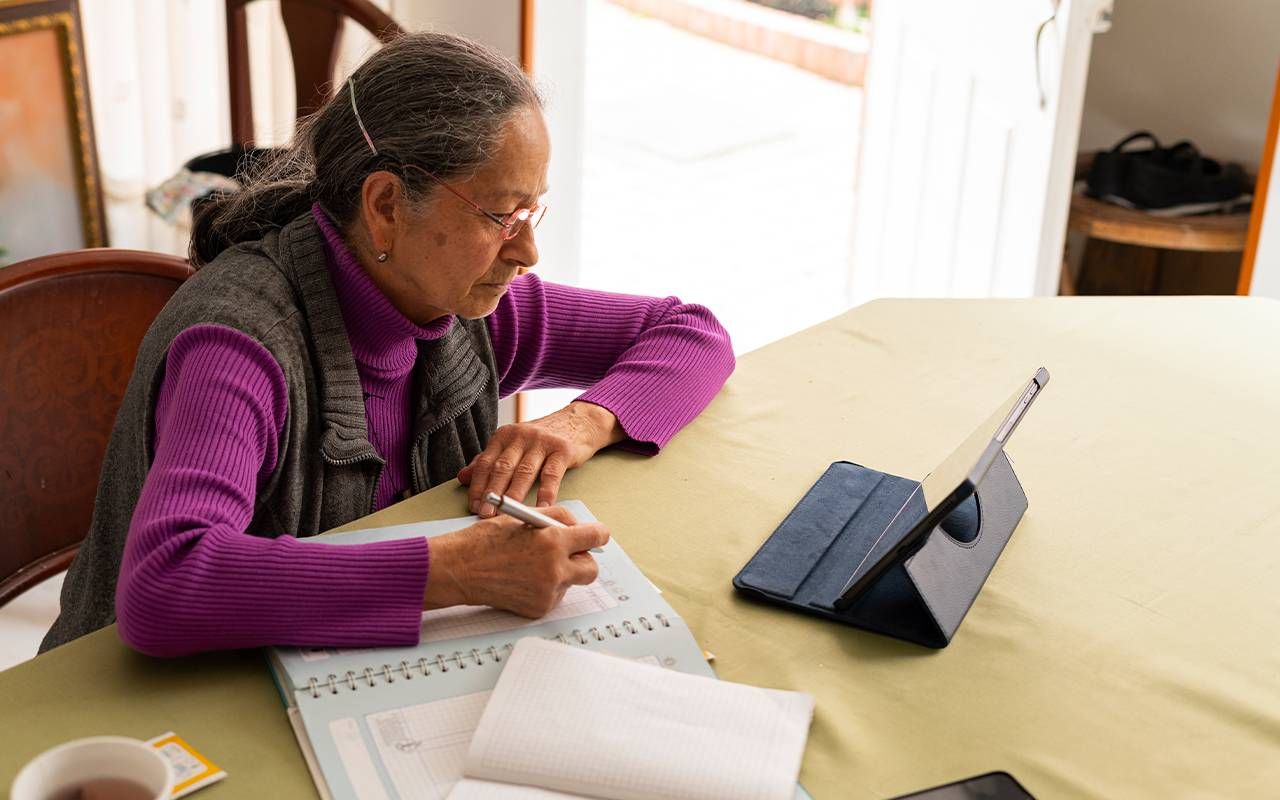 An older woman taking an online class. Next Avenue, continuing education, career change