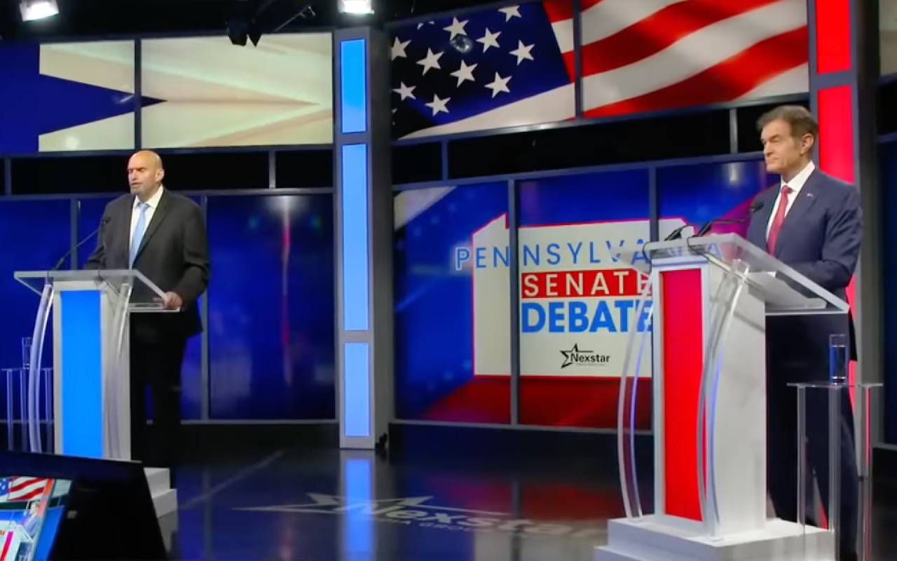 Pennsylvania Lt. Gov. John Fetterman and Dr. Mehmet Oz standing at podiums on a debate stage. Next Avenue, pennsylvania senate debate, stroke