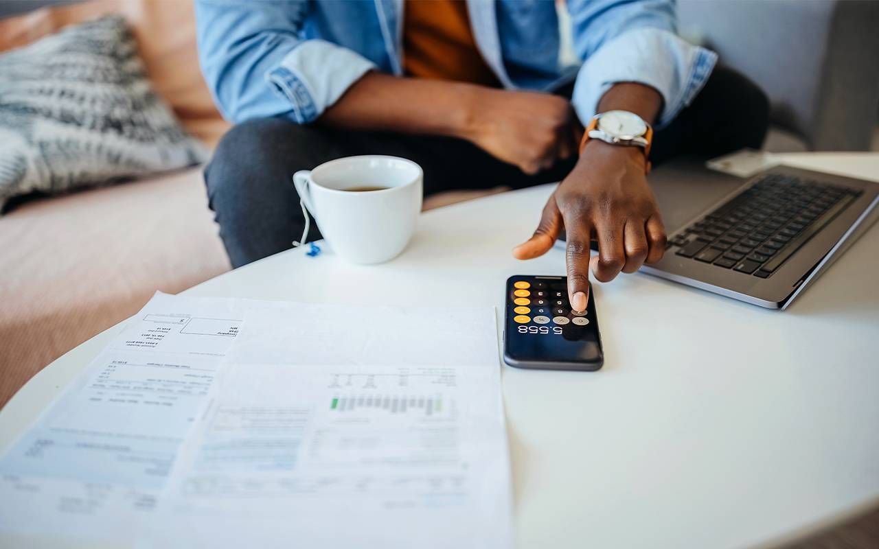 A person filling out their 2022 taxes. Next Avenue, tax tips