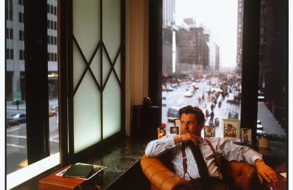A man looking out of the window in an office. Next Avenue, Jan Wenner, Rolling Stone, book