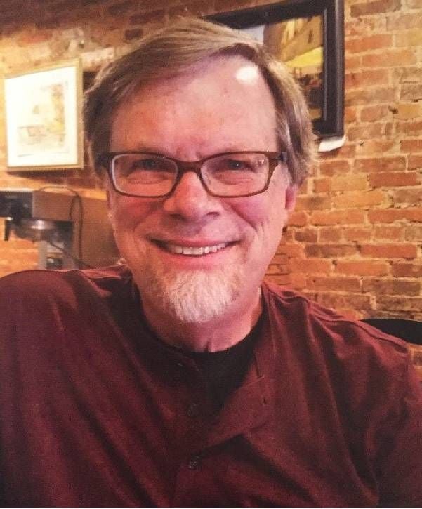 A man in front of a brick wall. Next Avenue, PTSD, Vietnam war, veterans